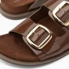 Vanessa Wu Mules plates Célia marron verni à boucles oversize< Mules | Sandales Plates